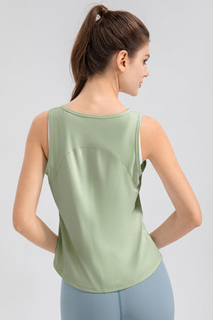 Light green performance tank top with curved back panel detail