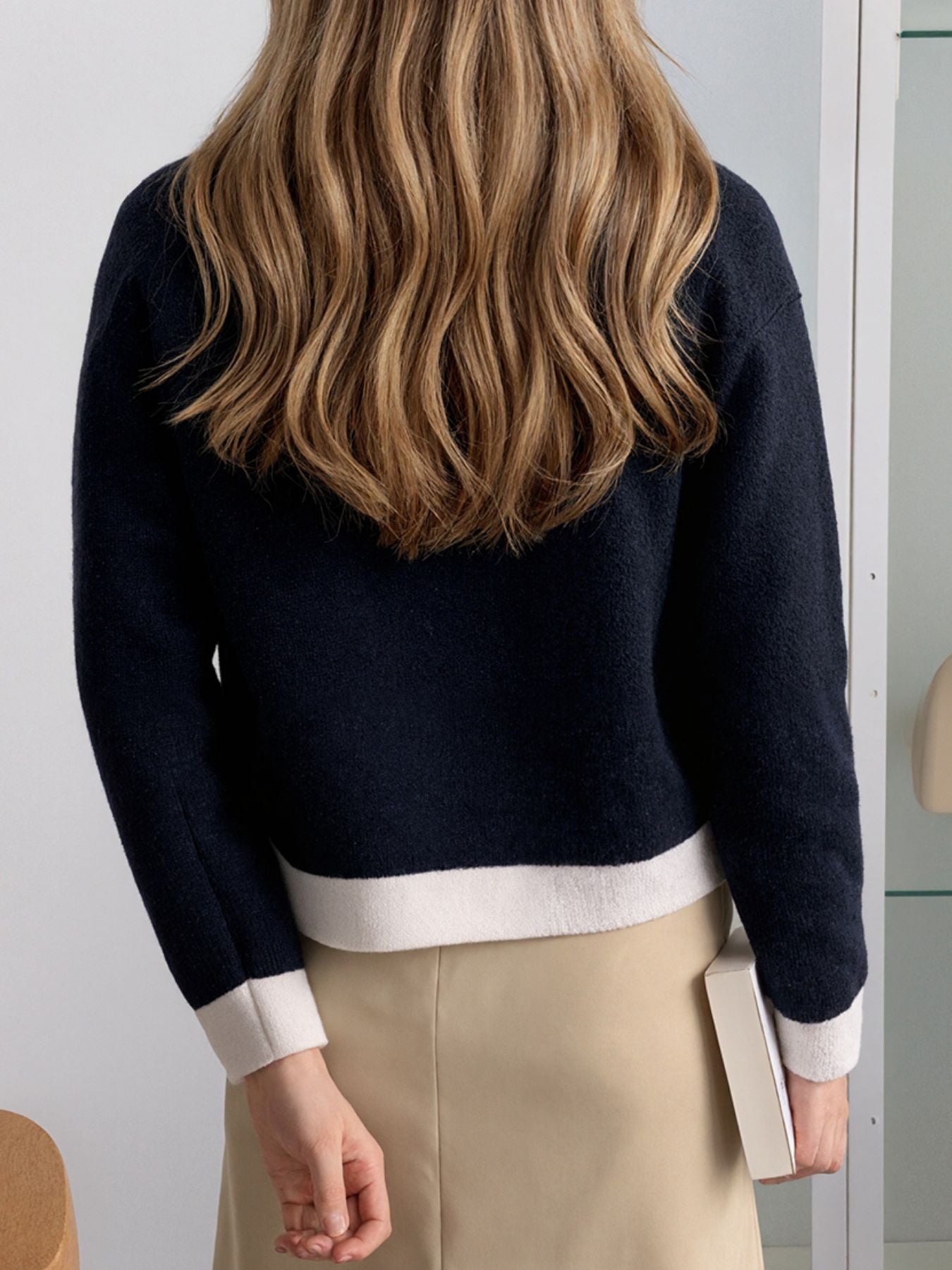 Navy acrylic cardigan with white contrast trim on hem and cuffs