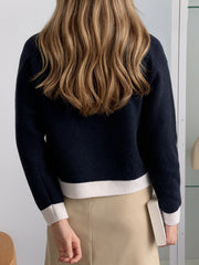 Navy acrylic cardigan with white contrast trim on hem and cuffs
