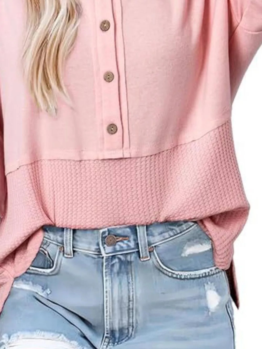 Pink waffle-knit t-shirt with button detail and contrast textured hem.