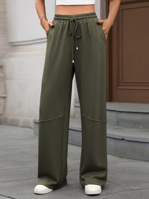 Army green high-waist drawstring wide-leg pants with pockets and seam detail.
