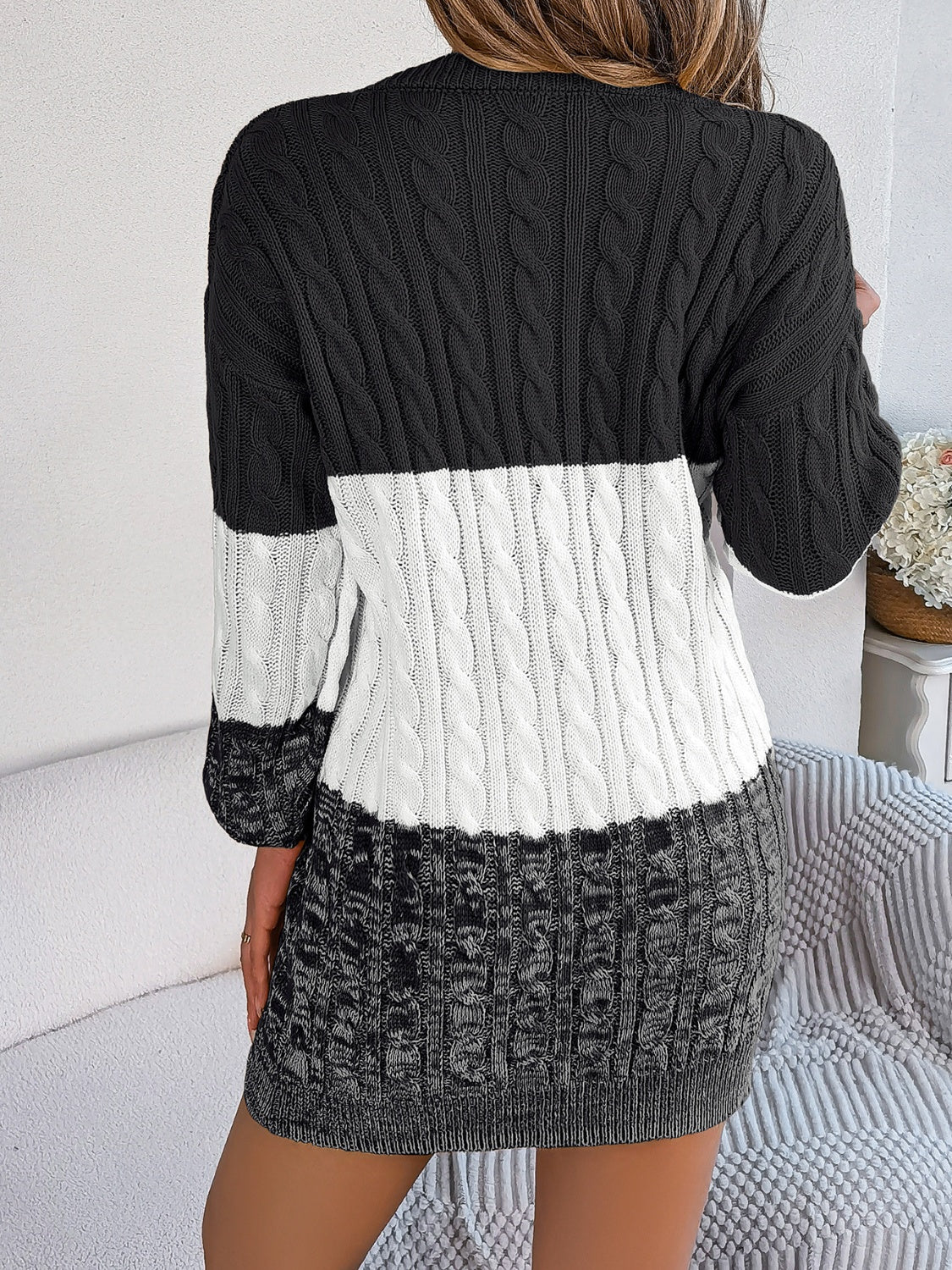 Colorblock cable knit mini dress in black, white, and grey acrylic.