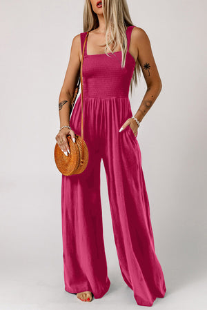Sway Square Smocked Jumpsuit in Deep Rose with wide legs and pockets.