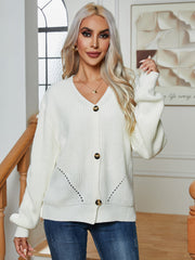 Chunky knit white button-down cardigan with V-neck and balloon sleeves.