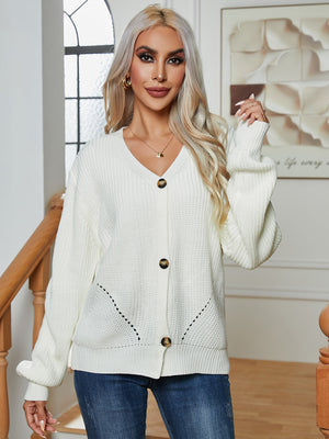 Chunky knit white button-down cardigan with V-neck and balloon sleeves.