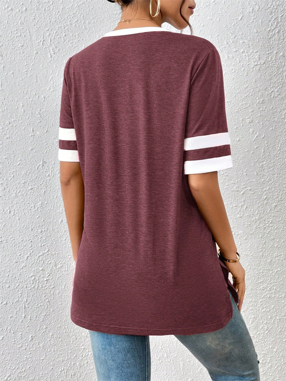 Plum contrast trim varsity tee with white stripes on sleeves and neckline.