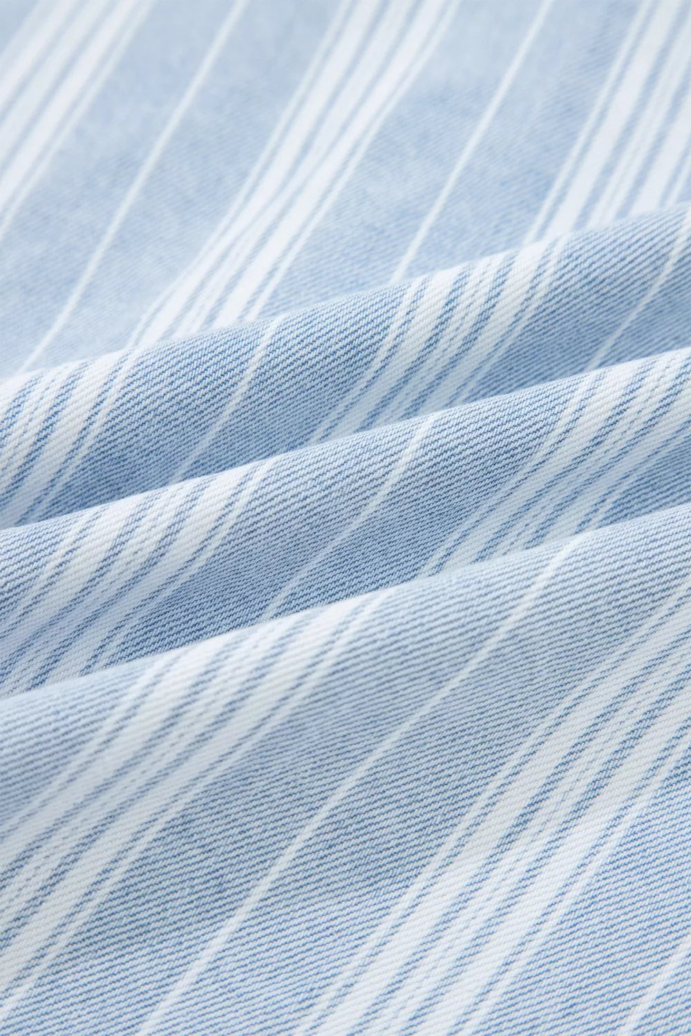 Relaxed denim shacket with blue and white stripes, cotton fabric detail