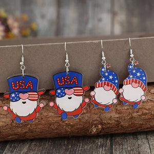 Patriotic gnome drop earrings in royal blue acrylic with USA hats and striped sunglasses.