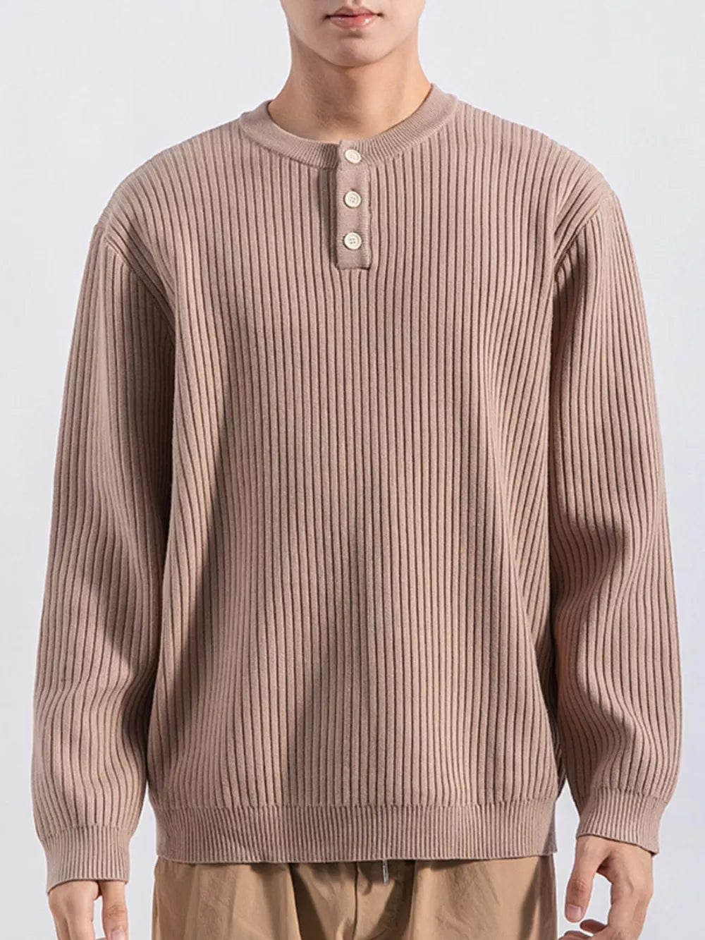 Men's apricot ribbed knit top with button details and crew neck.
