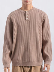 Men's apricot ribbed knit top with button details and crew neck.