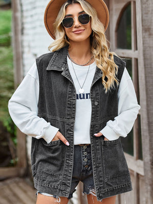 Black oversized denim utility vest with button front and chest pockets.