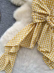 Yellow gingham cami top with twisted knot detail and asymmetrical hem