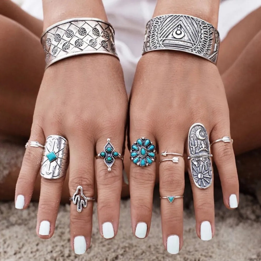 Bohemian silver statement ring set with turquoise stones and desert motifs.