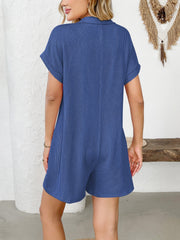 Dark Blue ribbed knit romper with collar and short sleeves.
