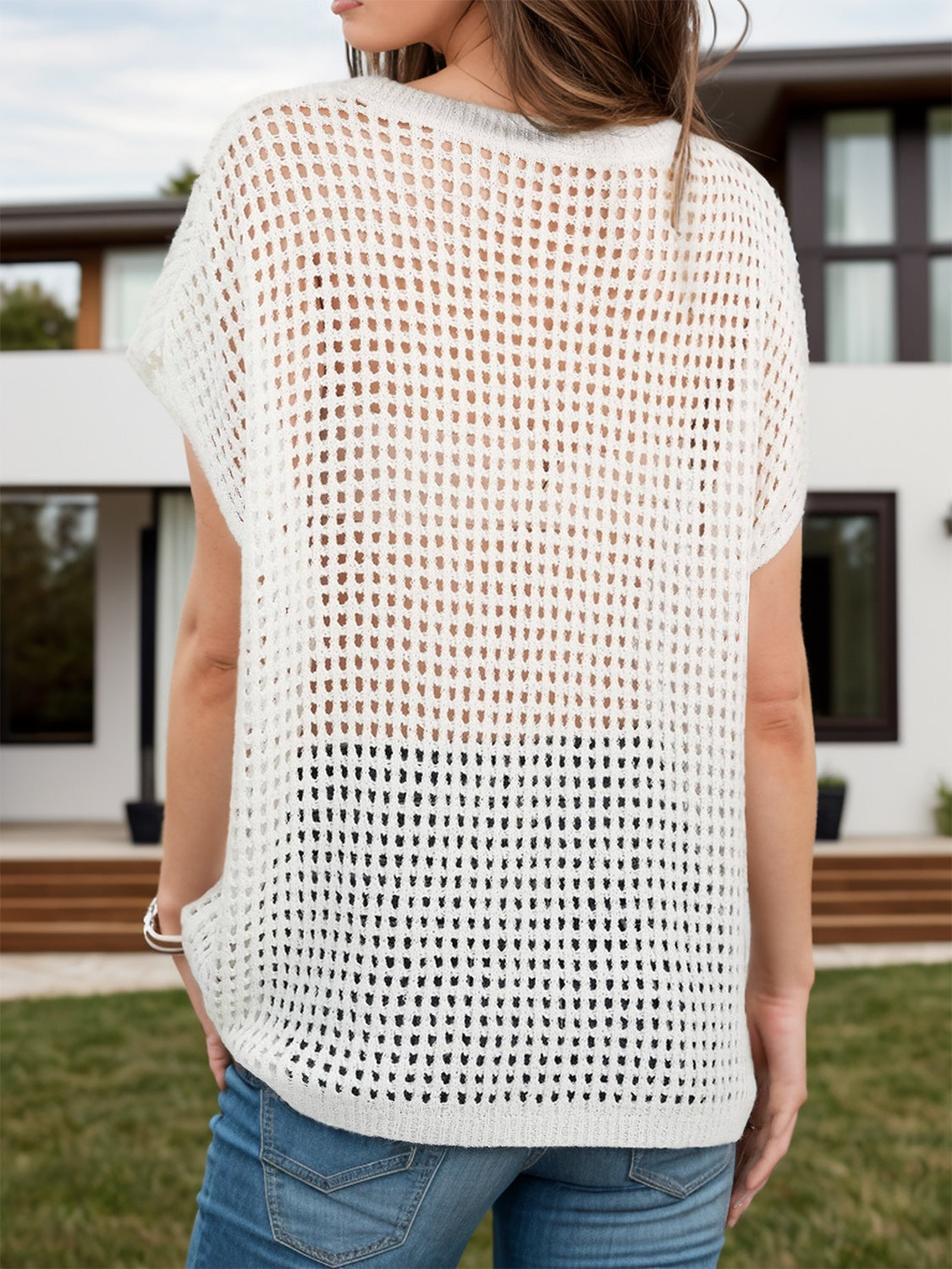 Open-knit boxy top in cream with short sleeves and a relaxed fit.