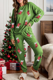 Green loungewear set with festive stocking print, long sleeves, crew neck, and drawstring pants.