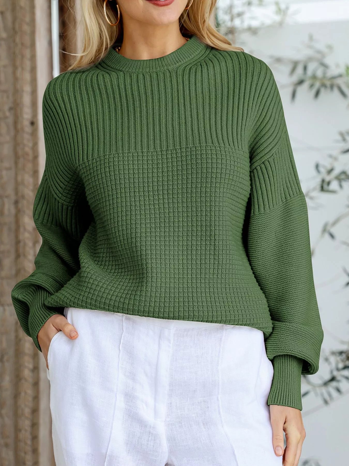 Moss green textured knit round-neck pullover sweater with a waffle knit panel.