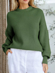 Moss green textured knit round-neck pullover sweater with a waffle knit panel.