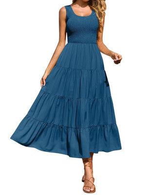 Smocked bodice ruffled maxi dress in Dusty Blue with tiered skirt and scoop neck.