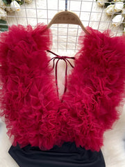 Ruffled V-neck bodysuit in Wine Red with lace tie detail and sheer tulle overlay.