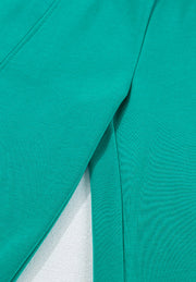 Turquoise loungewear set with visible stitching detail.