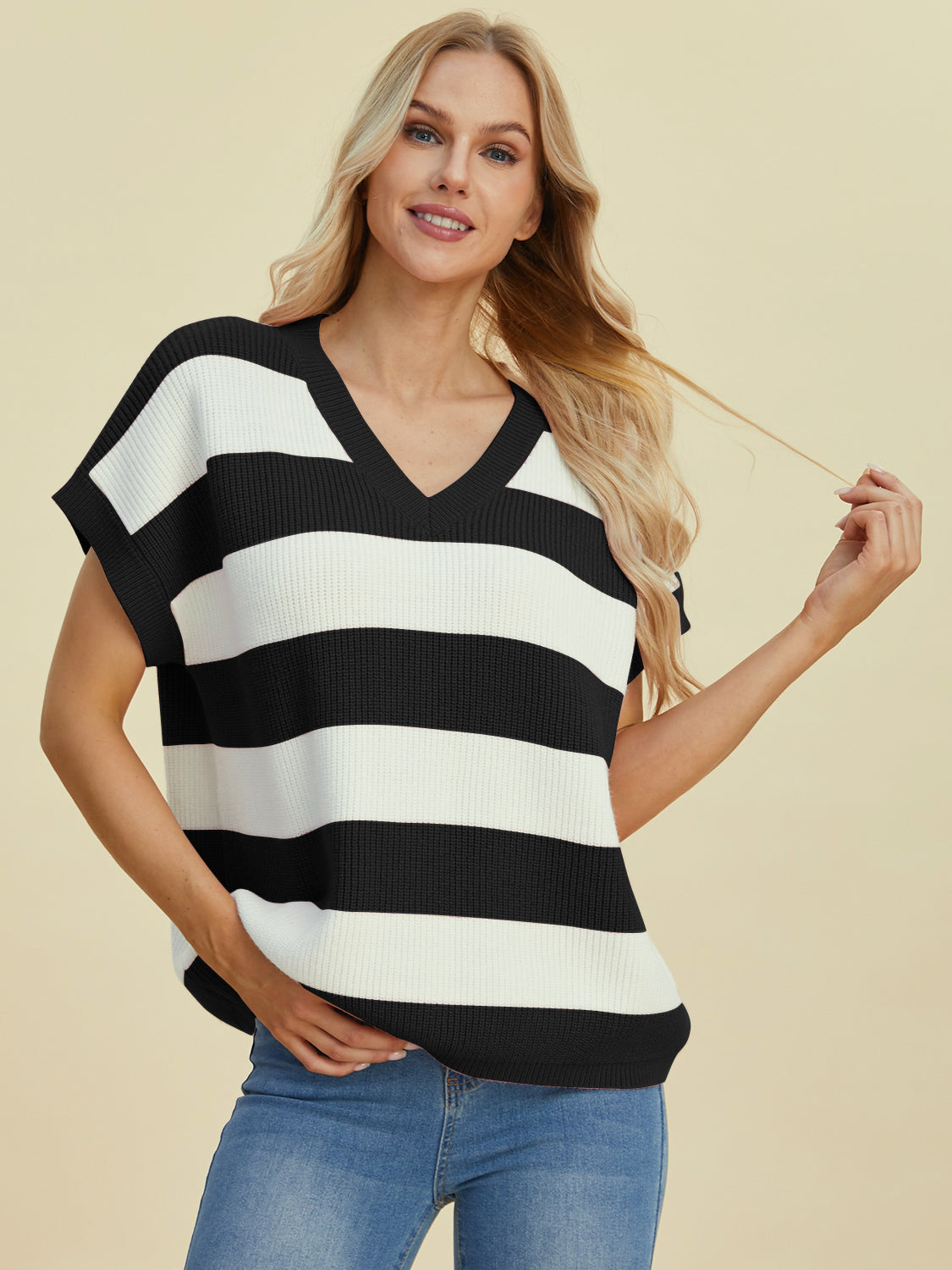 Bold Stripe Cap-Sleeve Knit Top in black and white with V-neck.