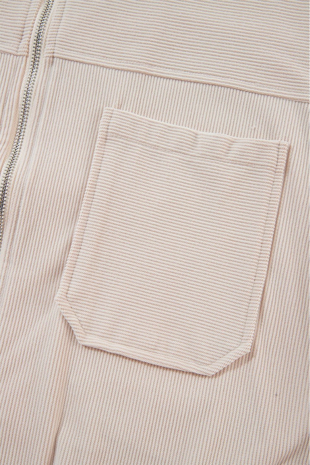 Cream corduroy bomber hoodie with a chest pocket and zipper detail.