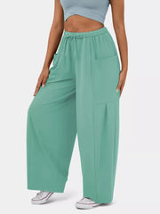 Light Green maternity wide-leg pants with drawstring waist and pockets.