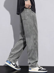 Relaxed fit grey cotton jeans with drawstring waist and casual styling.