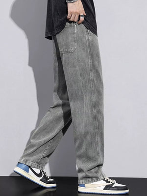 Relaxed fit grey cotton jeans with drawstring waist and casual styling.