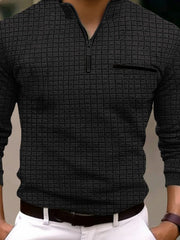 Black textured zip-neck polo with contrast pocket detail and long sleeves.