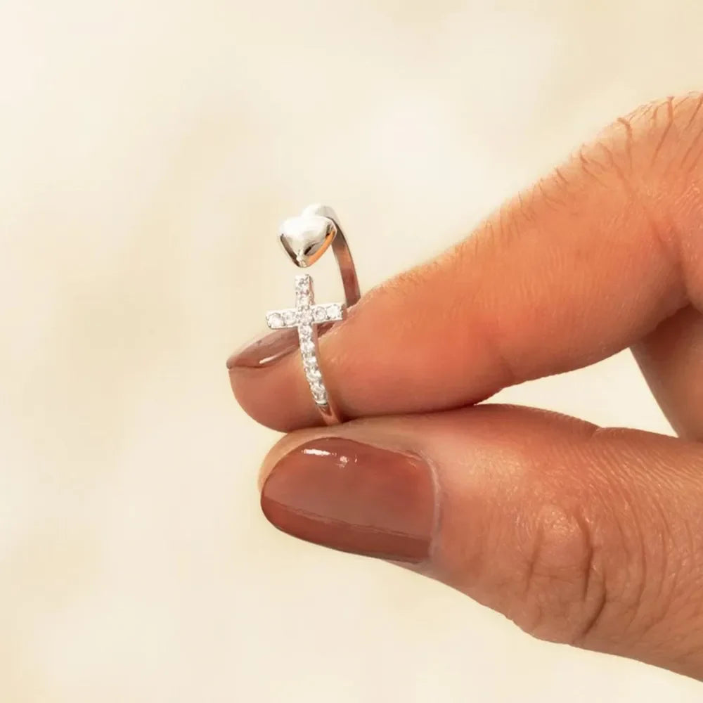 Silver ring with open heart and diamond cross detail