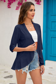 Dark blue perforated peplum sleeve cardigan with 3/4 sleeves and open front.