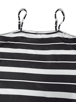 Plus size black and white striped maxi dress with adjustable spaghetti straps.