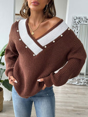 Brown ribbed knit V-neck sweater with pearl trim and white stripe detail.