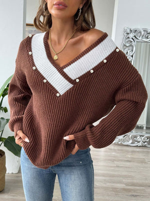 Brown ribbed knit V-neck sweater with pearl trim and white stripe detail.