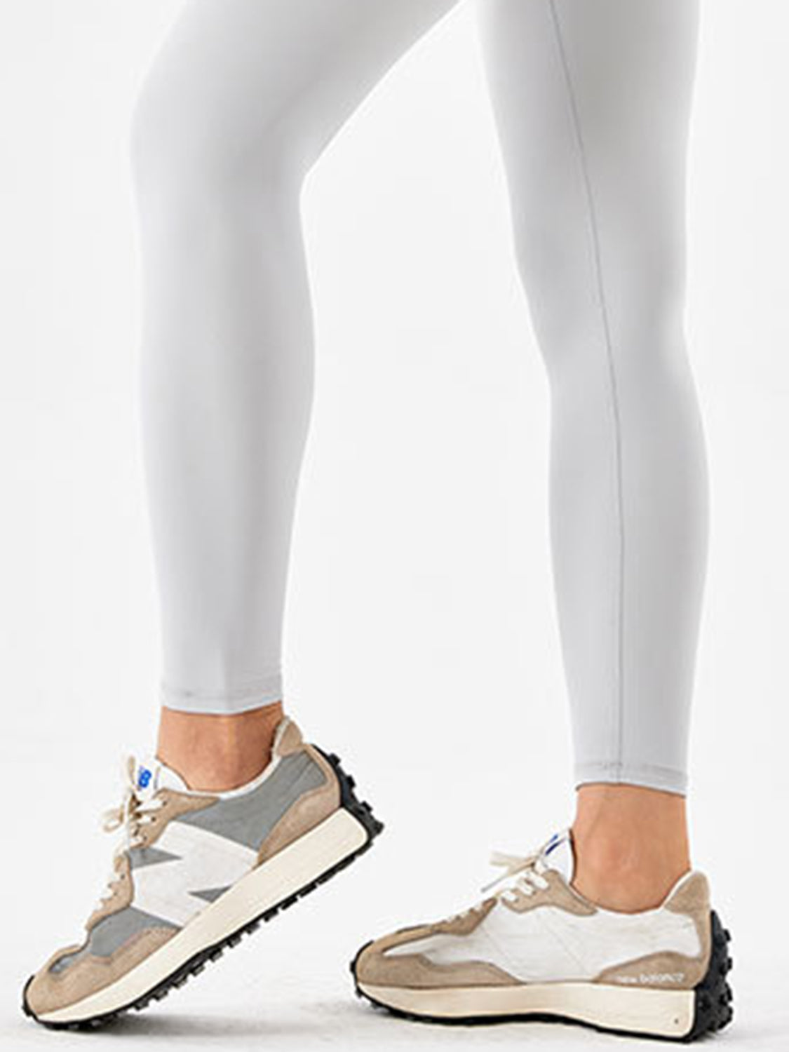Light gray high-waist leggings with a seamless inseam detail.