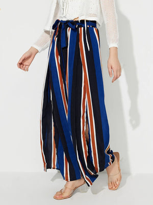 Striped palazzo trousers with side slits and a tie waist in blue, white, and rust.