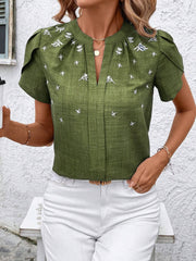 Matcha green embroidered floral keyhole blouse with flutter sleeves.