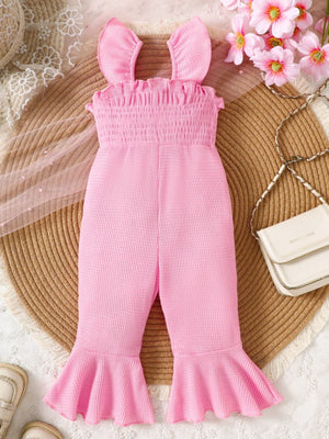 Pink smocked jumpsuit with ruffled straps and bell bottoms.
