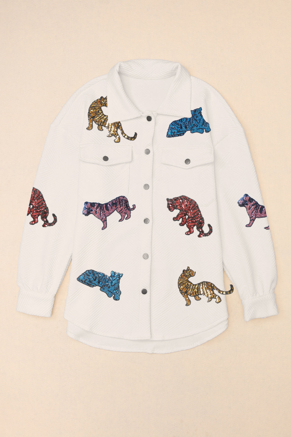 White quilted overshirt with colorful embroidered tiger patches and button front.