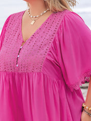Hot pink eyelet yoke romper with flutter sleeves and lace trim.
