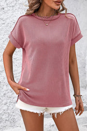 Deep Rose vertical ribbed tee with split hem and short sleeves.
