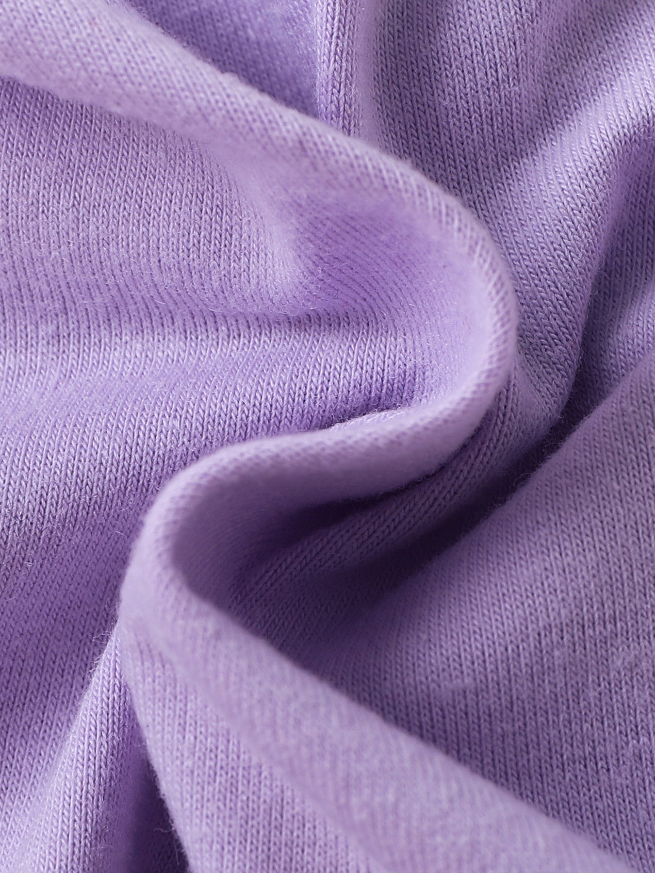 Lavender baby set fabric detail, soft knit texture.