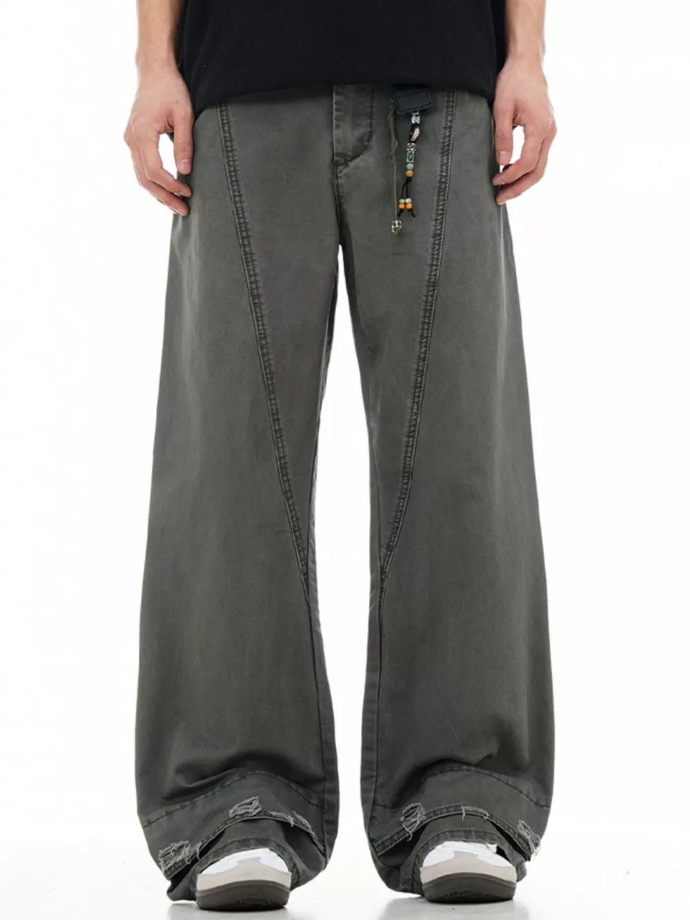 Men's wide-leg denim trousers in dark grey with distressed hem detail and beaded drawstring.
