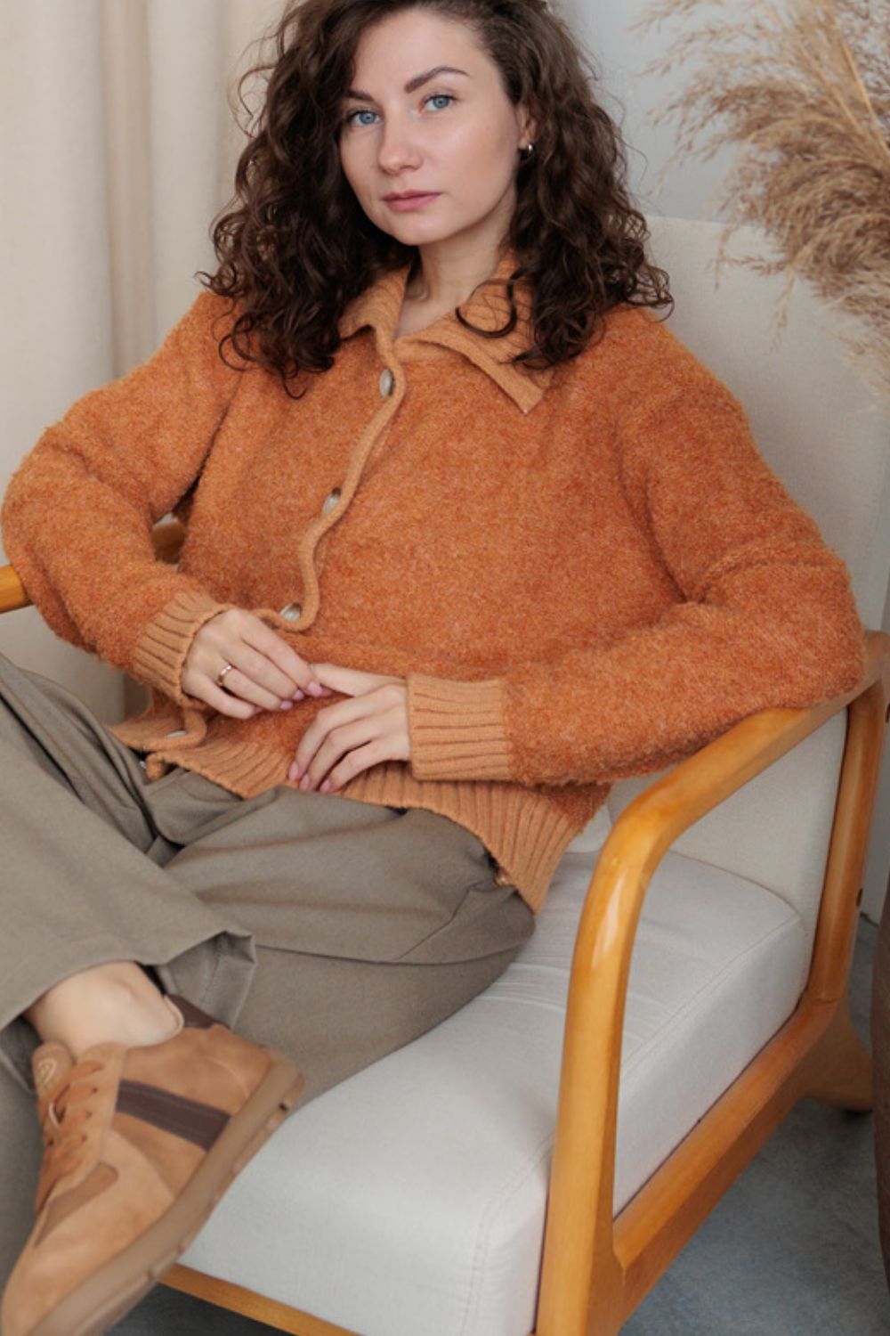 Textured bouclé collar cardigan in tangerine with button front and ribbed cuffs.