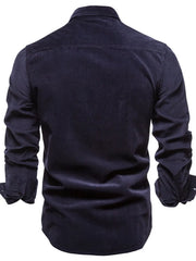 Indigo corduroy utility shirt with button-down collar and long sleeves, back view.
