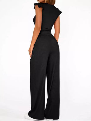 Black ruffled cap sleeve maternity jumpsuit with wide leg pants.
