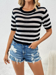 Open-knit striped crew neck top in black and white with short sleeves.