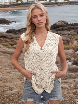 Beige openwork button-down knit vest with V-neck and wooden buttons.